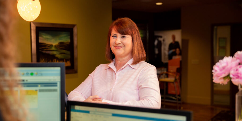 Patient at the front desk within the dental practice