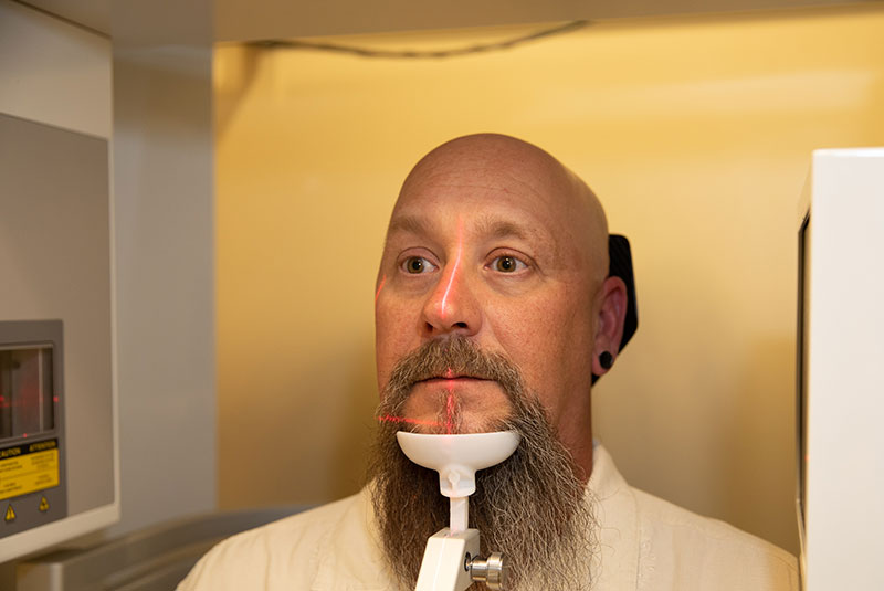 Patient undergoing dental 3d scanning device for procedure