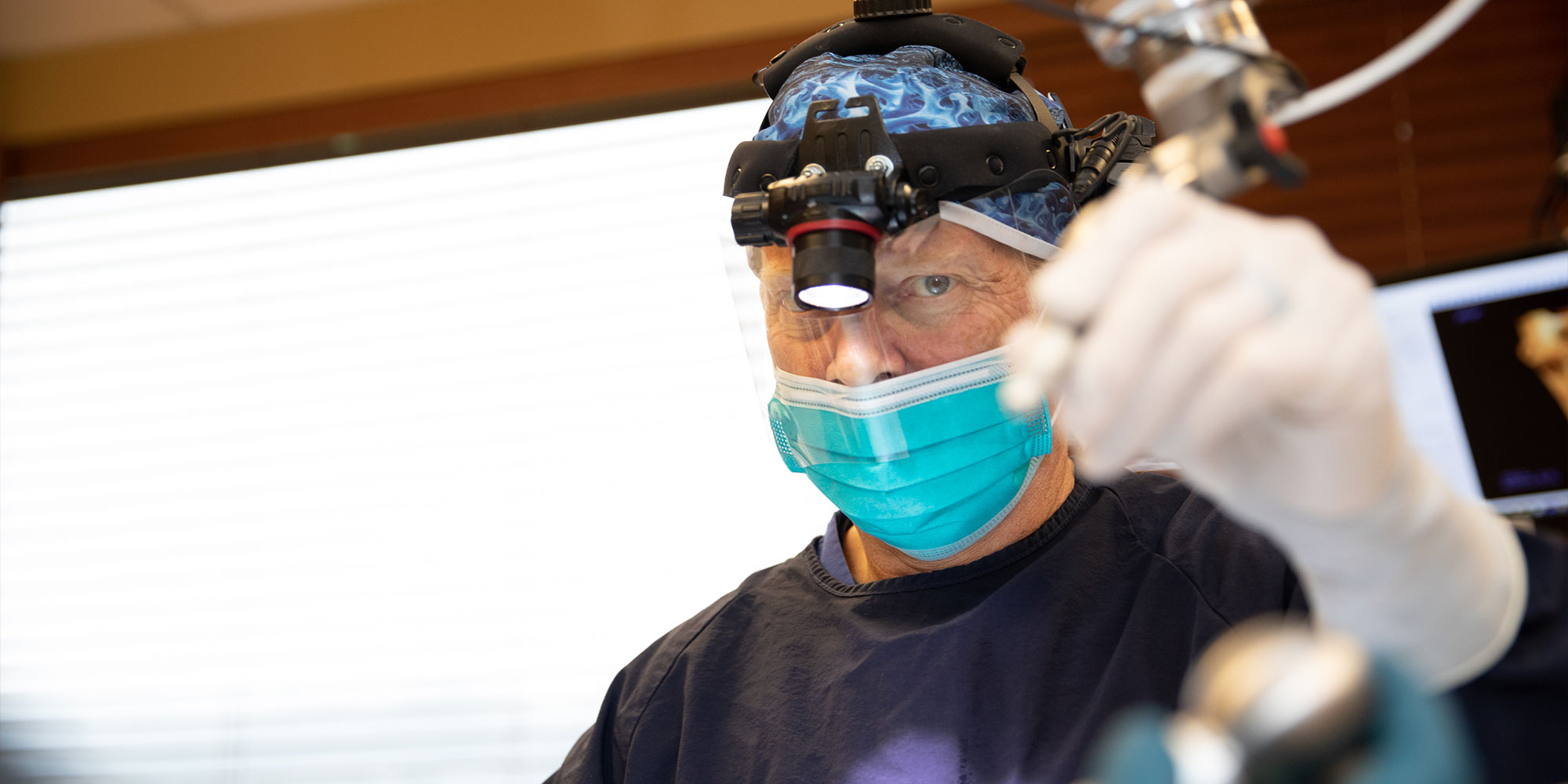 doctor performing dental procedure with patient